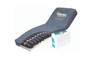 Alternating Air Mattress with pump. Section cut out in bottom right corner to reveal the air cells within.