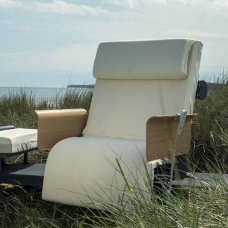 Opera RotoBed® Home Rotating Bed set outdoors with grass all around and blue skies behind, depicting a new found freedom that this bed can provide