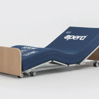 Opera Solo Floor Bed with oak wood head and footboards in the low position with head and feet raised. Opera pressure care mattress on the bed without a sheet.