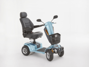 Motion Xcite Mobility Scooter fully assembled, about to turn to the right. Blue colour.