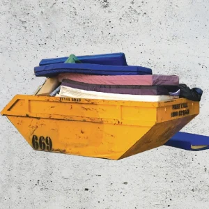 Nest Technology - image is of a skip with traditional pressure care mattresses in. Nest is recyclable and reusable.
