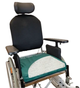 The NEST Pressure Care Cushion on a wheelchair with the cover pulled back to reveal the inner core.