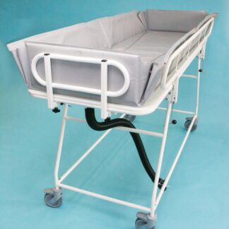 Freeway Fixed Height Shower Trolley with ABS liner, drainage pipe, cot sides and ends, fully assembled on a blue background