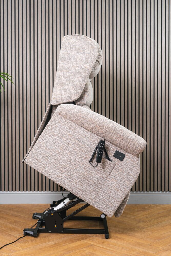 Riser recliner chair lift assist position Riser recliner chair tilted forward in lift assist position helping user stand safely